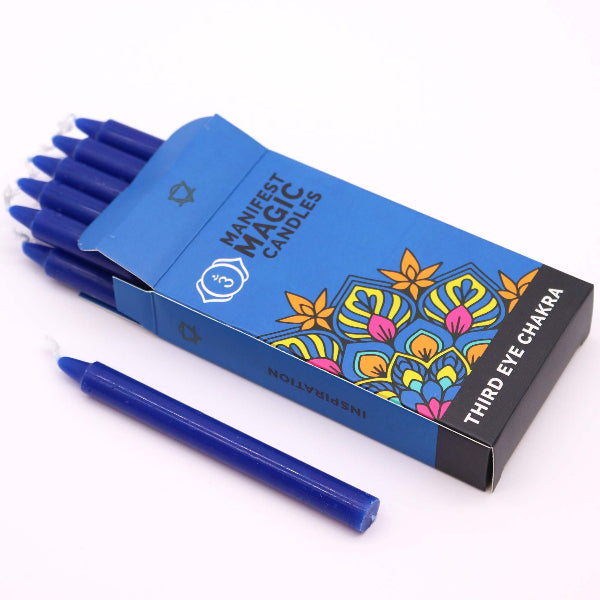 Box of Manifest Magic Candles with a blue candle on a white background