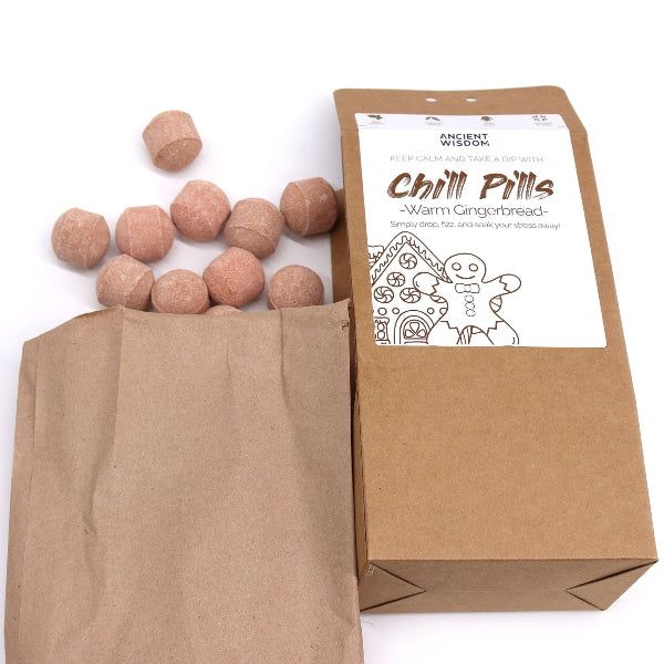 Brown paper bag with gingerbread-themed 'Chill Pills' and packaging on a white background