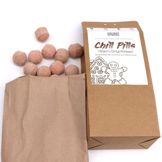 Brown paper bag with gingerbread-themed 'Chill Pills' and packaging on a white background