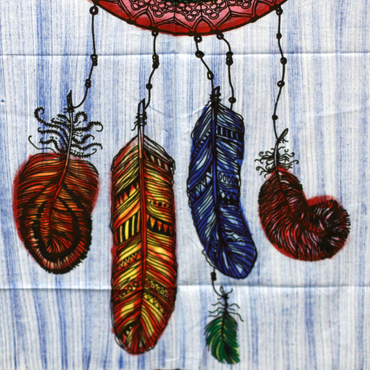 Colorful feather design on a textured fabric background