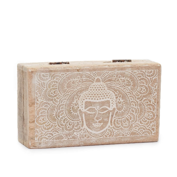 Wooden block with Buddha engraving on a white background