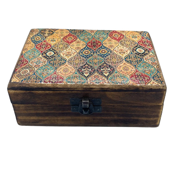 Wooden box with decorative lid featuring a geometric pattern on a white background