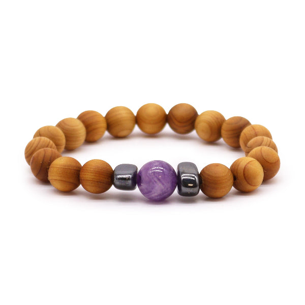 Wooden beaded bracelet with purple and silver beads on a white background