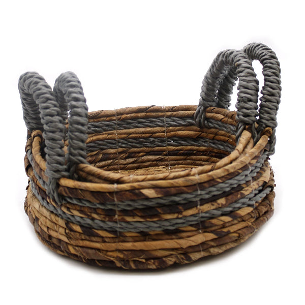 Woven basket with gray handles on a white background