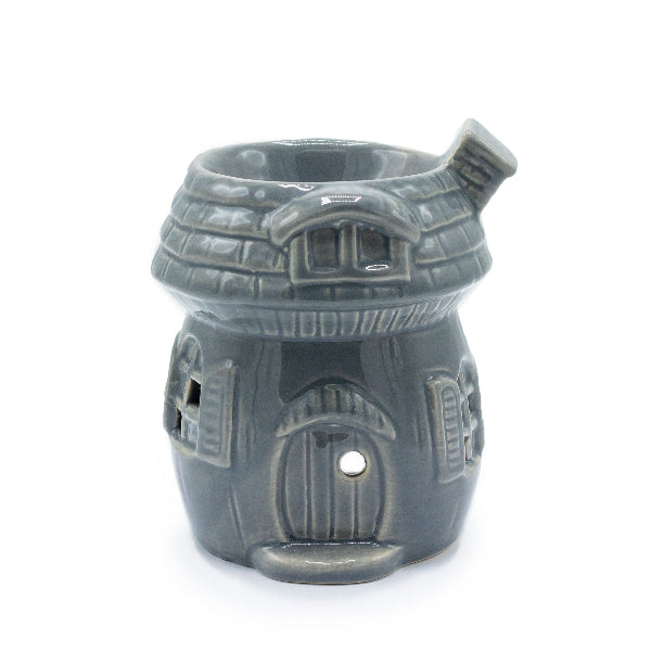 Gray ceramic house-shaped oil burner on a white background
