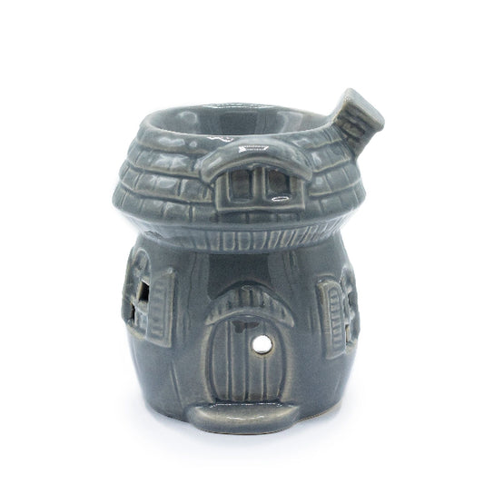 Gray ceramic house-shaped oil burner on a white background