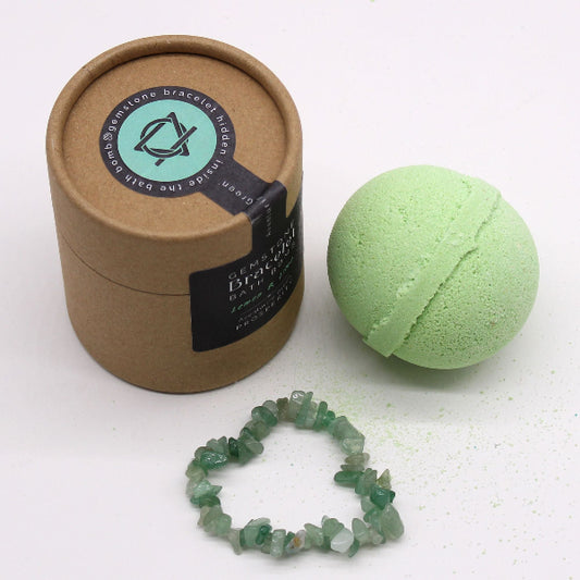 Green bath bomb, bracelet, and packaging on a white background