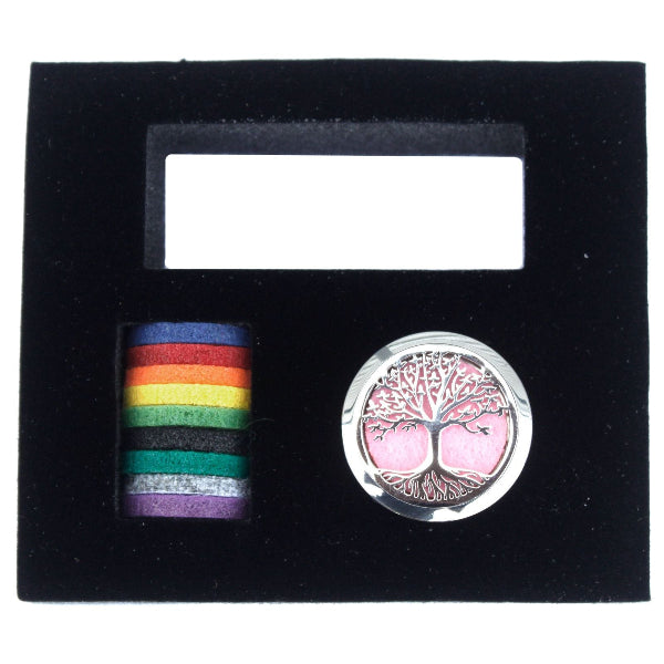 Two pins in a black display case: one rainbow-colored and one with a tree design.