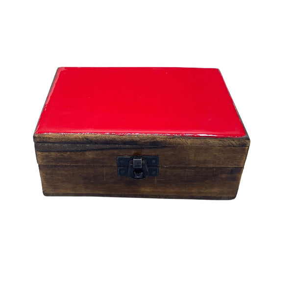 Wooden box with a red lid on a white background