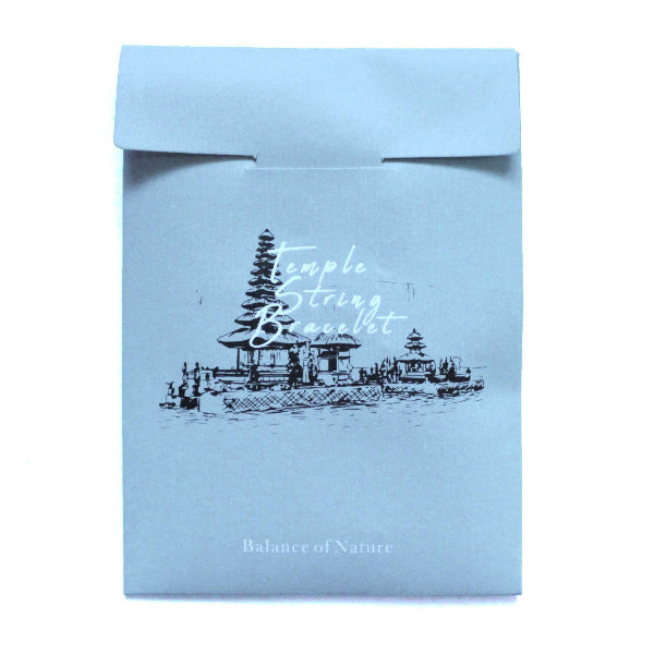 Light blue packaging with temple illustration and text on a white background