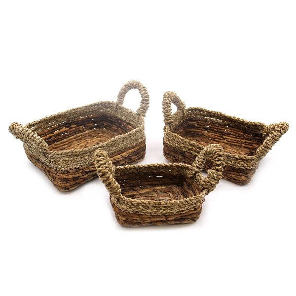 Three woven baskets of different sizes on a white background