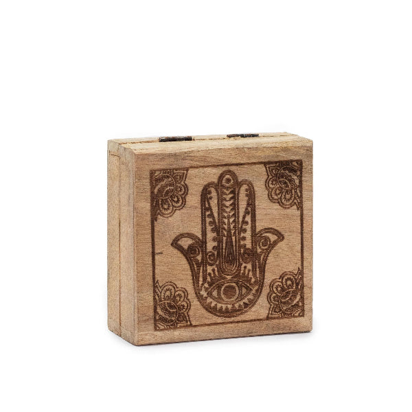Wooden box with Hamsa hand design on a white background