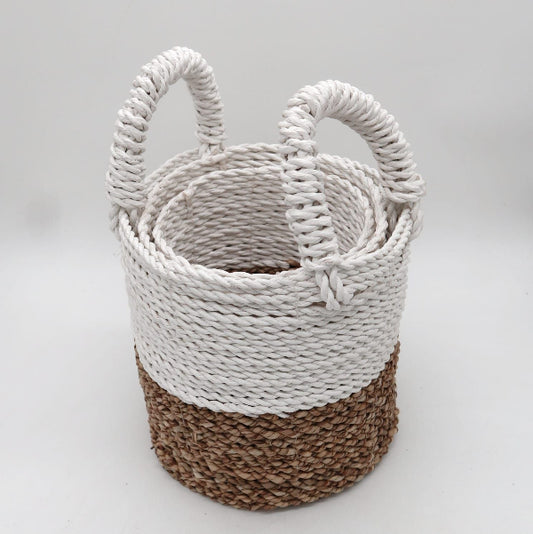 Woven basket with white top and brown bottom on a light gray background