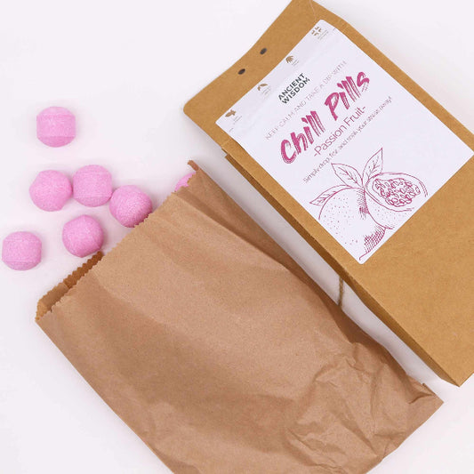 Box of 'Chill Pills' with pink balls on a white background