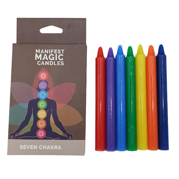 Set of colorful candles with packaging labeled 'Manifest Magic Candles Seven Chakra' on a white background.