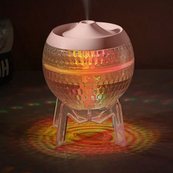 Colorful disco ball with light projection on a dark background