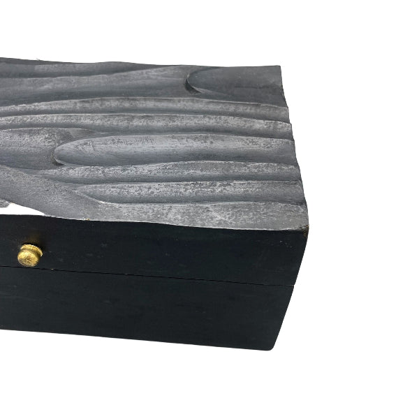 Black jewelry box with textured gray lid on a white background