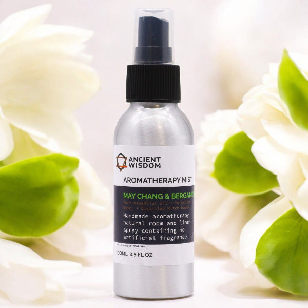 Aromatherapy mist bottle with flowers in the background