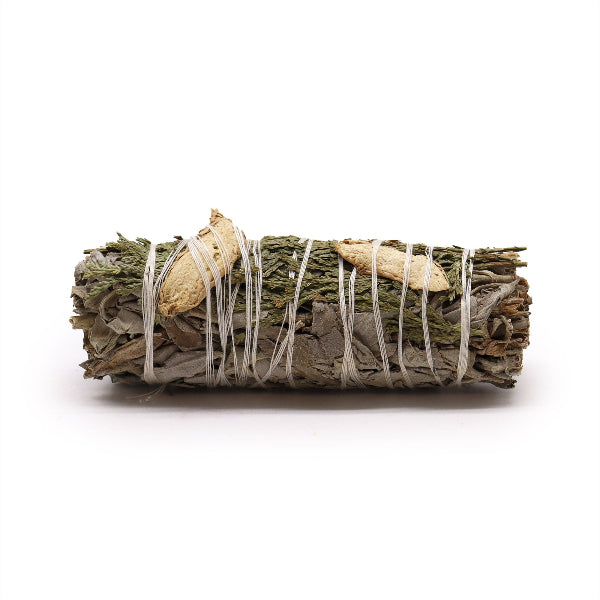 Bundled sage with white string on a white background