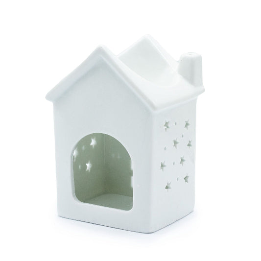 White ceramic house-shaped lantern with star patterns on a white background