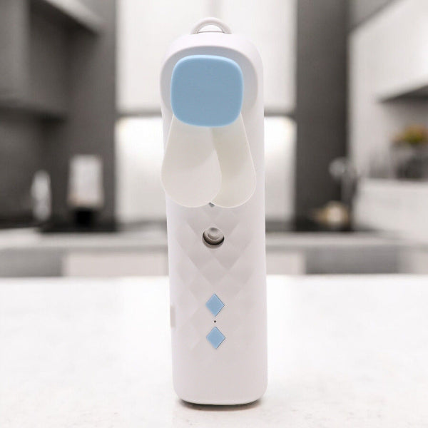 White electronic device with blue accents on a blurred kitchen background
