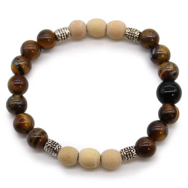 Beaded bracelet with brown, beige, and black beads on a white background
