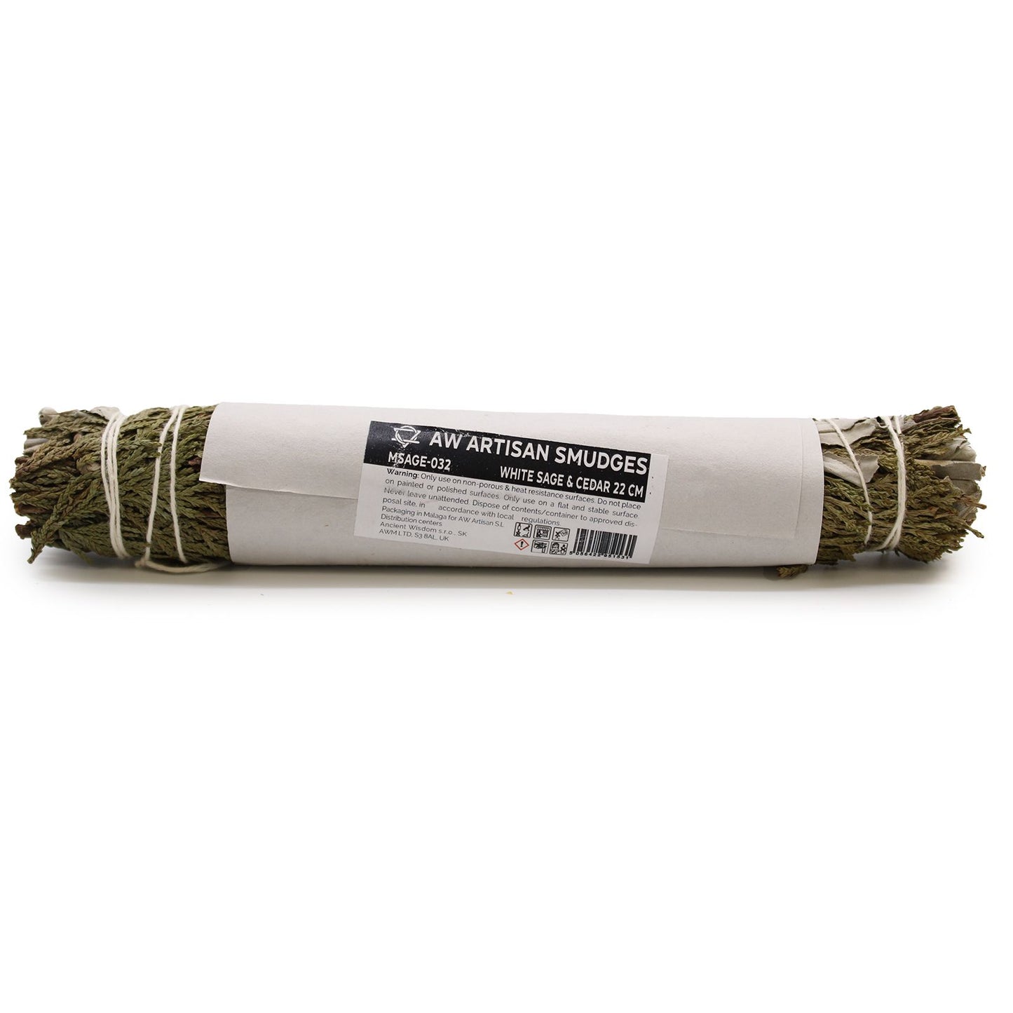 Artisan smudge stick wrapped in paper with a label on a white background