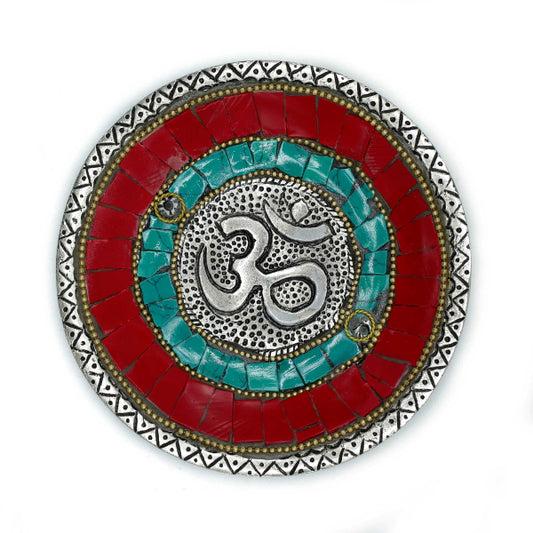 Decorative plate with Om symbol and colorful mosaic design on a white background