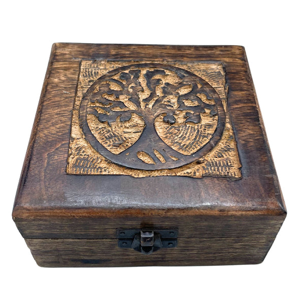 Wooden box with a decorative emblem on a white background