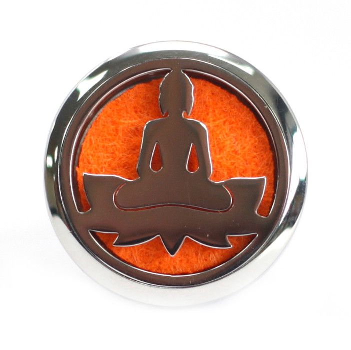 Decorative button with a silhouette of a person in meditation on an orange background, framed by a silver border.