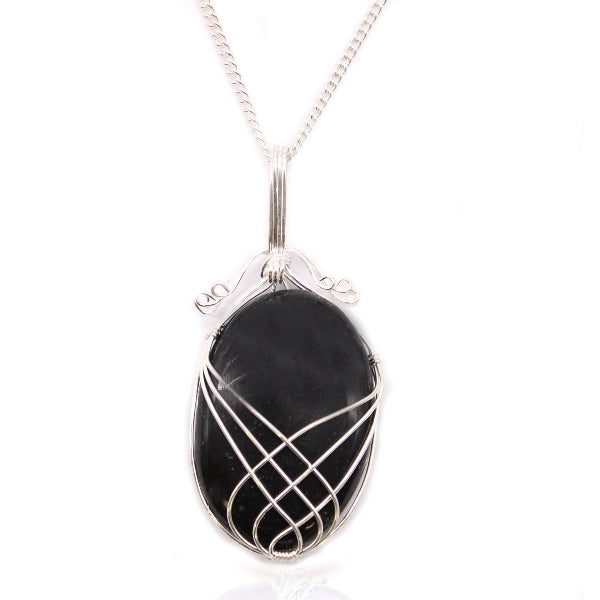Black stone pendant with silver wire wrapping on a white background