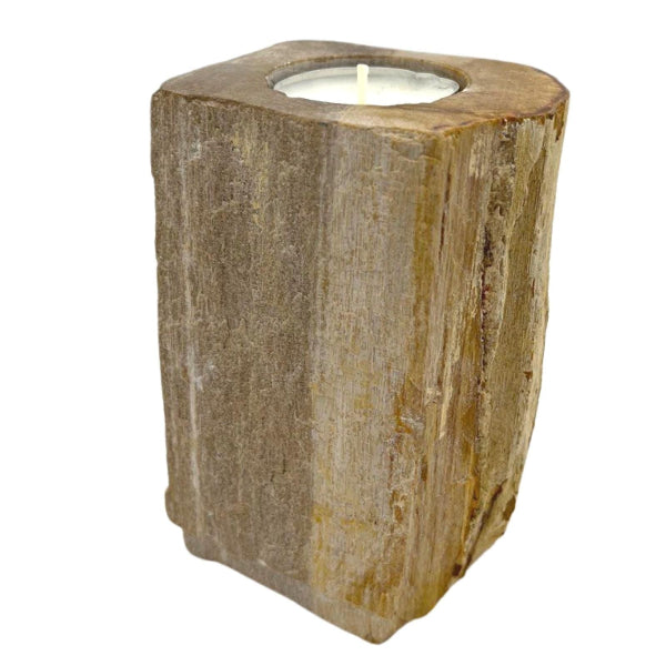 Wooden candle holder with a candle inside on a white background