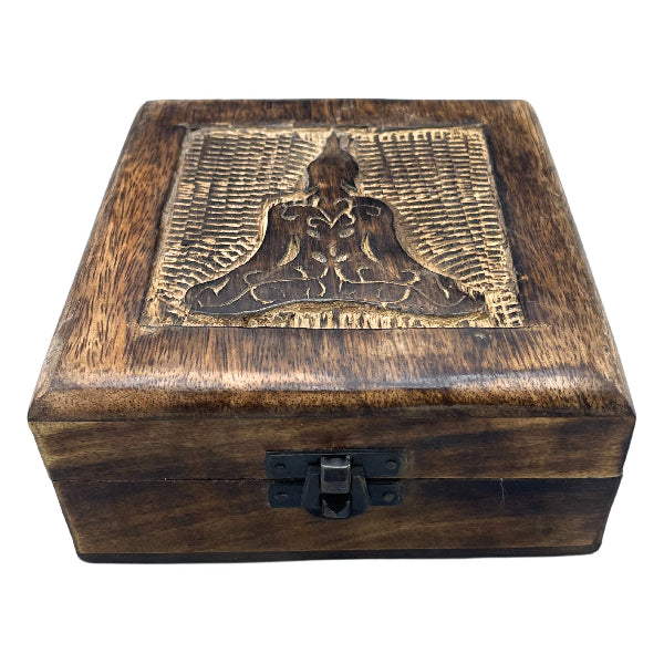 Wooden box with a engraved design on the lid against a white background