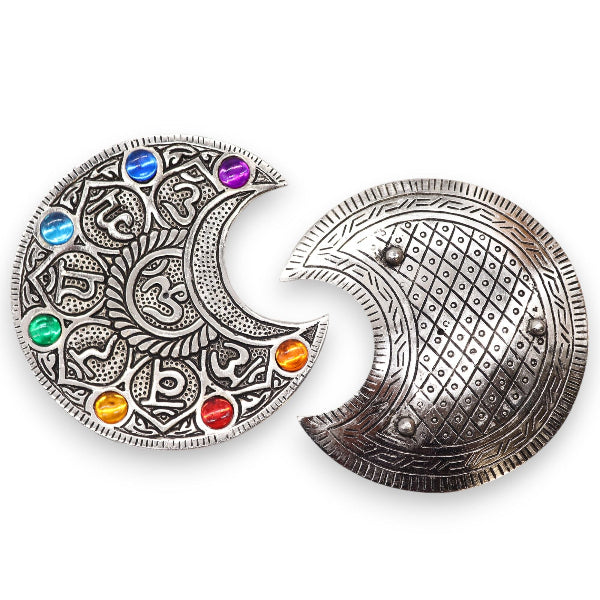Silver belt buckle with intricate designs and colorful stones on a white background