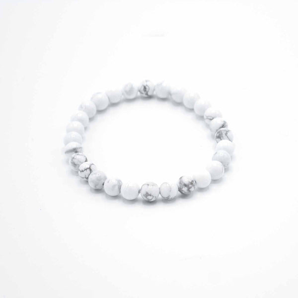 White beaded bracelet on a white background