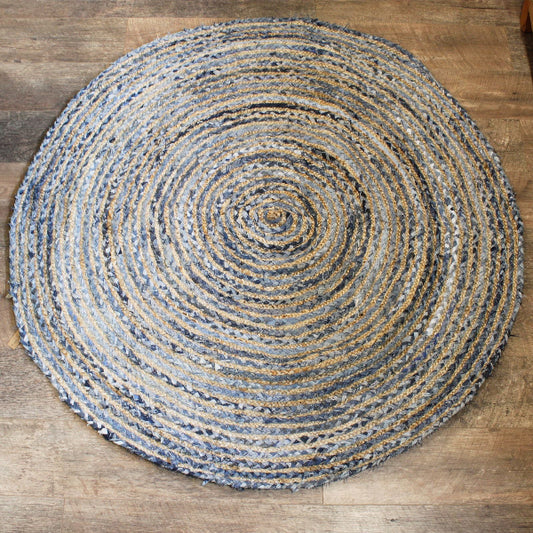 Round braided rug on a wooden floor