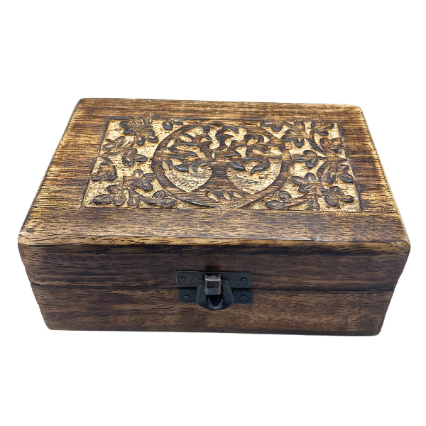 Wooden box with tree of life design on a white background