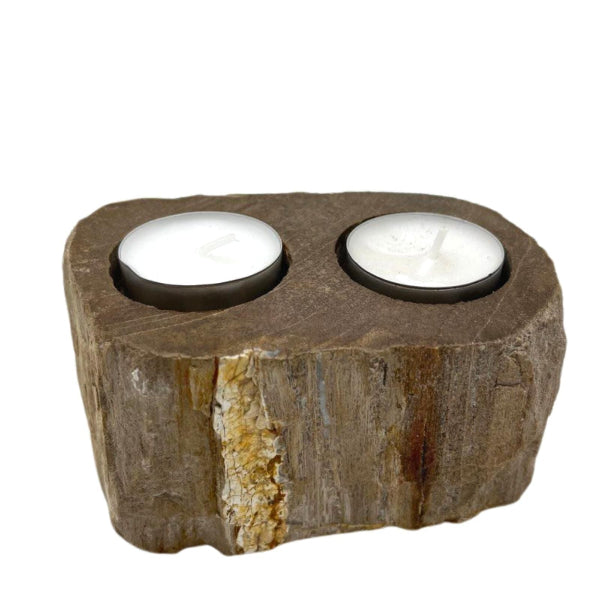 Rustic stone candle holder with two candle holders on a white background