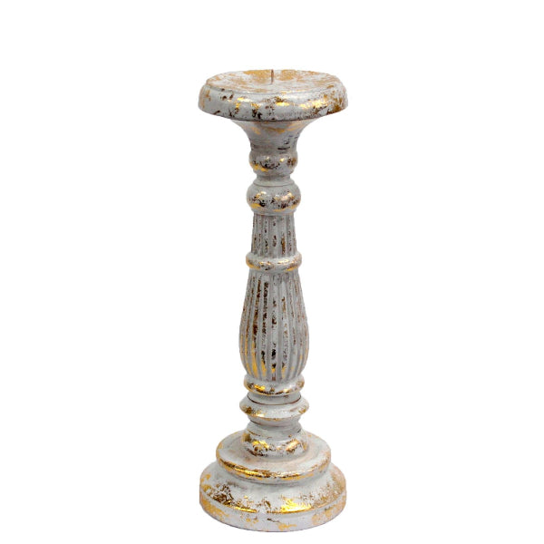 Decorative candle holder with a white and gold finish on a white background