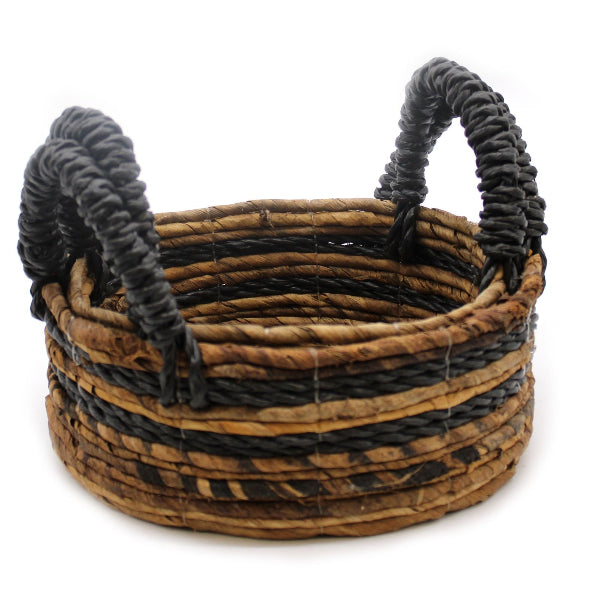 Woven basket with dark handles on a white background