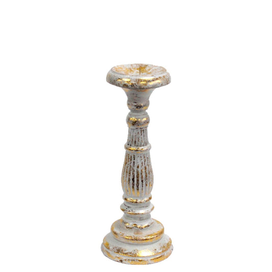 Decorative candle holder with white and gold finish on a white background