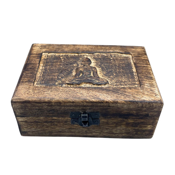 Wooden box with a Buddha engraving on a white background