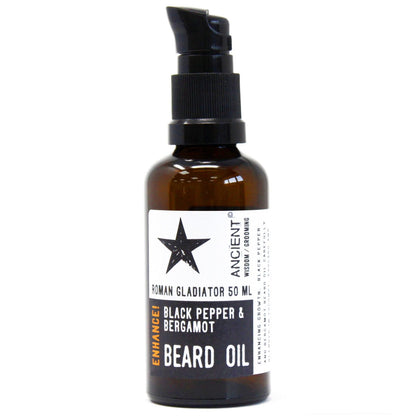 Brown bottle of beard oil with a black star label on a white background