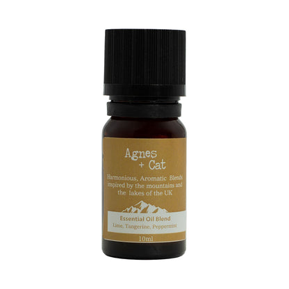 Bottle of Agnes + Cat essential oil blend on a white background