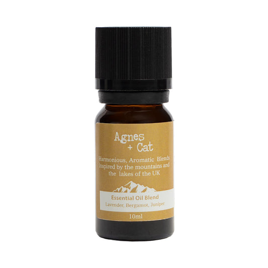 Essential oil blend bottle with 'Agnes + Cat' label on a white background