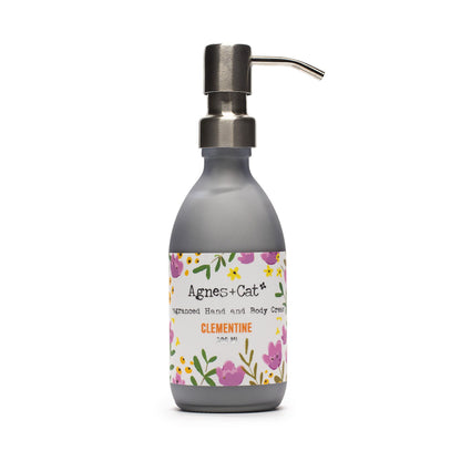 Hand cream bottle with floral label on a white background