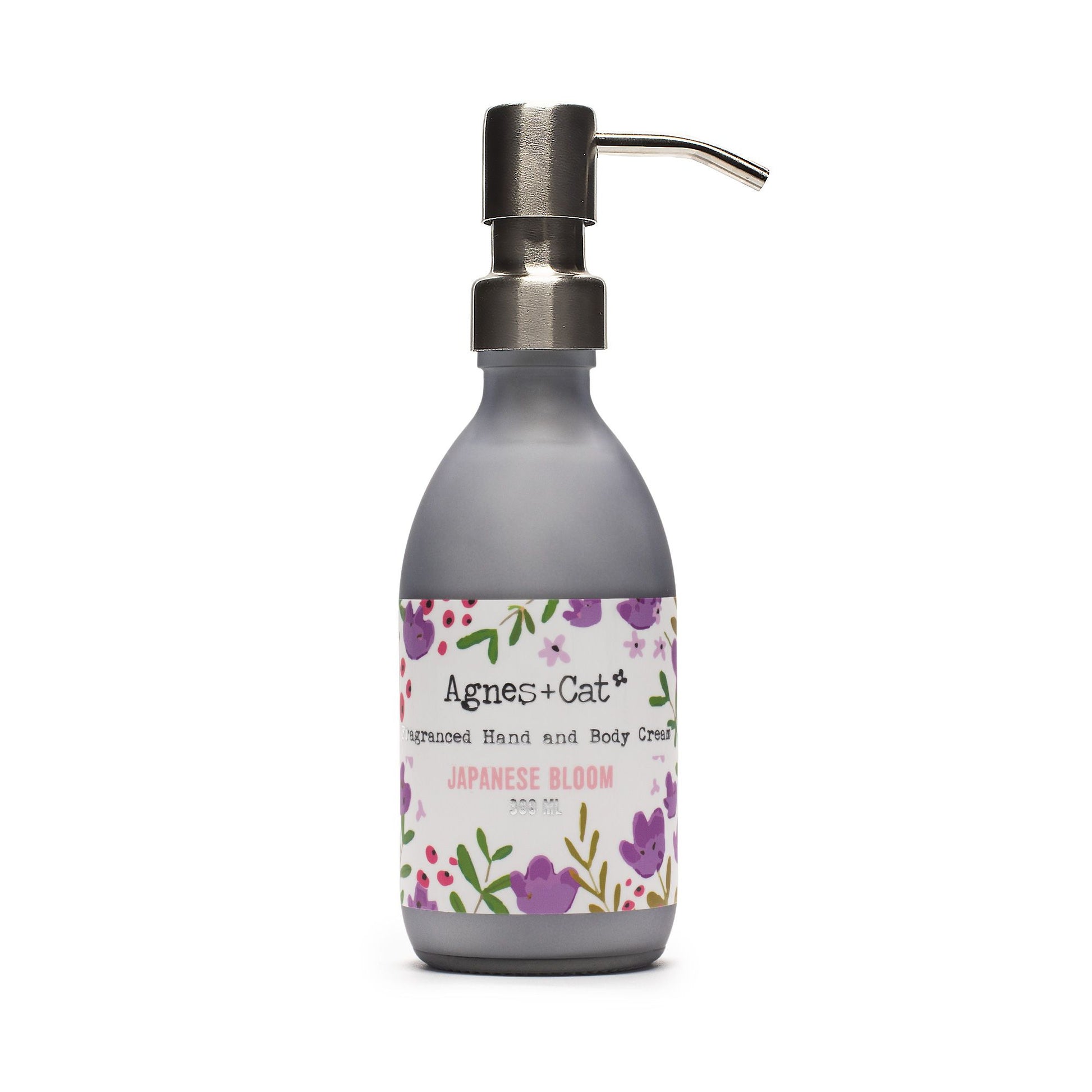 Hand cream bottle with floral label on a white background
