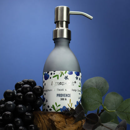 Bottle of Agnes & Co Provence soap with a pump dispenser on a blue background