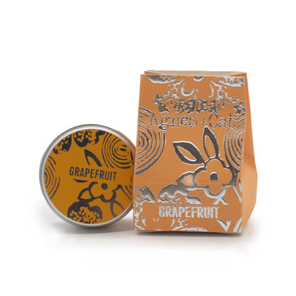 Grapefruit product with packaging featuring 'Agnes & Cat' branding on a white background