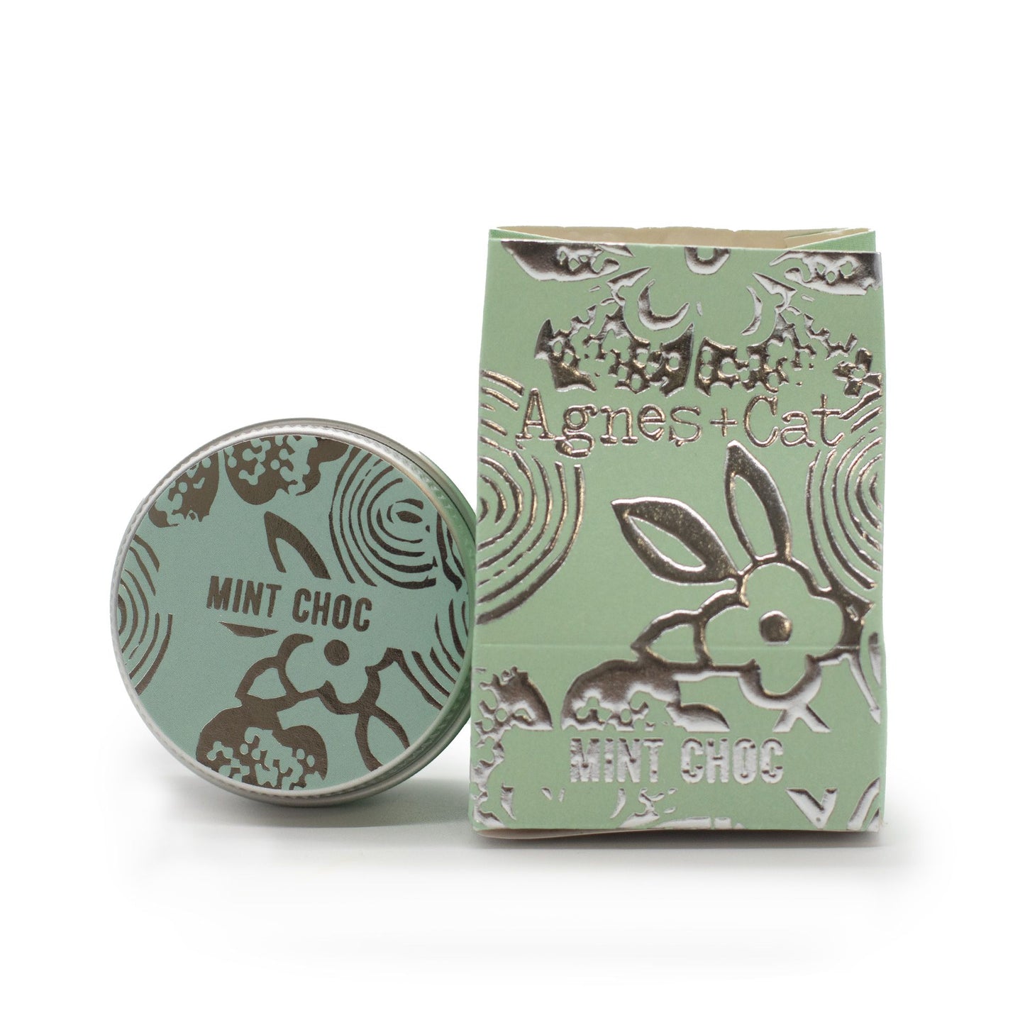 Mint green container and packaging with 'Agnes + Cat' branding on a white background